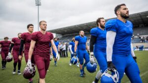 Generic international American football teams walk onto a neutral field before a club game